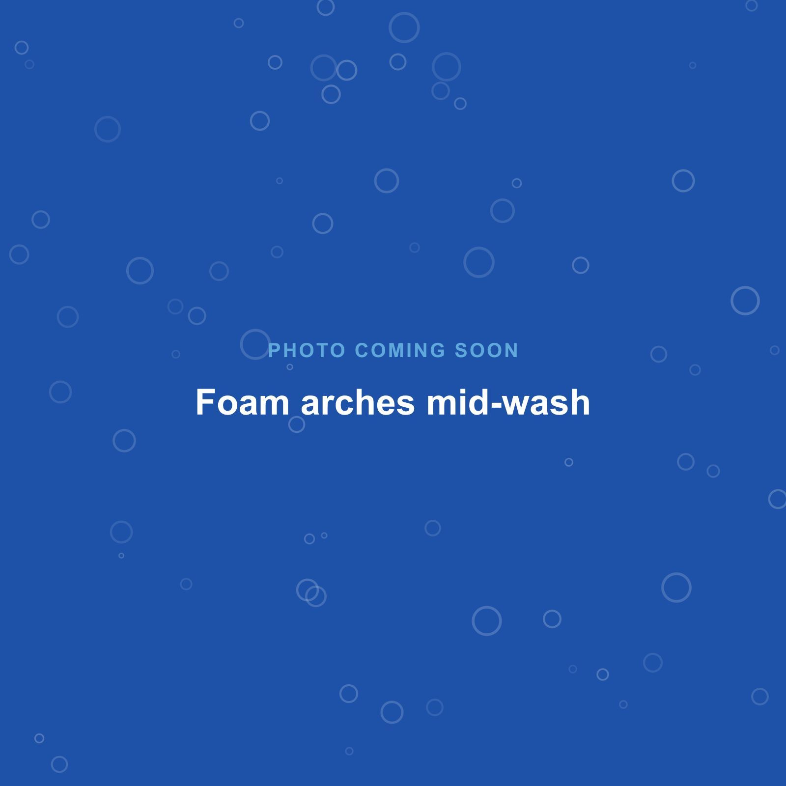 Foam arches covering a car in the automatic bay
